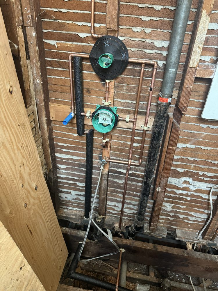 Copper water heater supply lines with pressure regulator and expansion tank installed by 5Star Plumbing Plus in Dubuque, IA